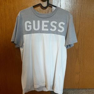 A grey and white guess t shirt size small mens